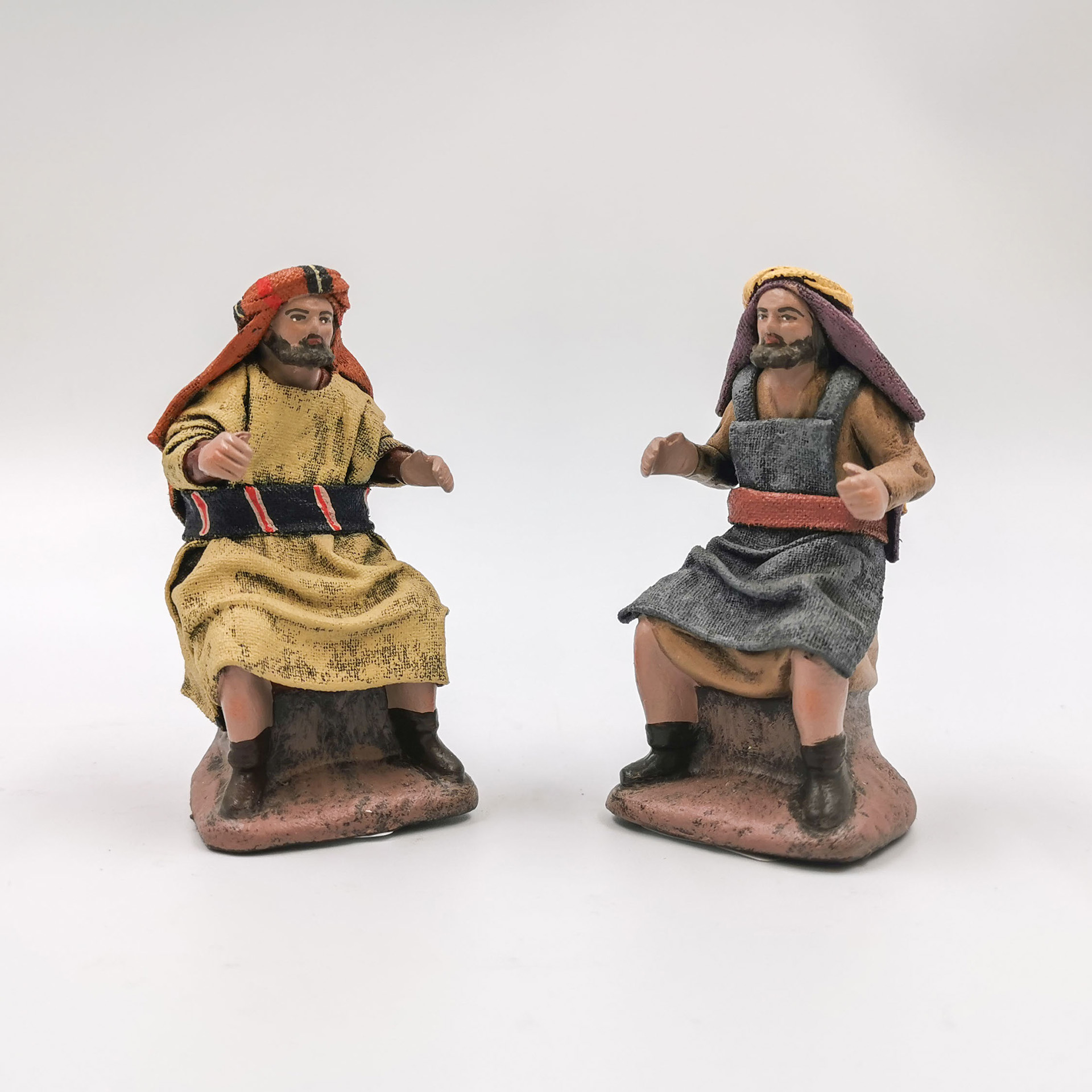 Krippenfigur Verkäufer sitzend